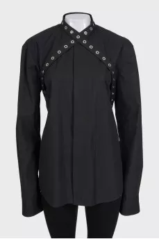 Black shirt decorated with eyelet ties