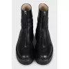 Black leather zip-up boots