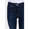 Blue flared jeans with a button