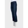 Blue flared jeans with a button
