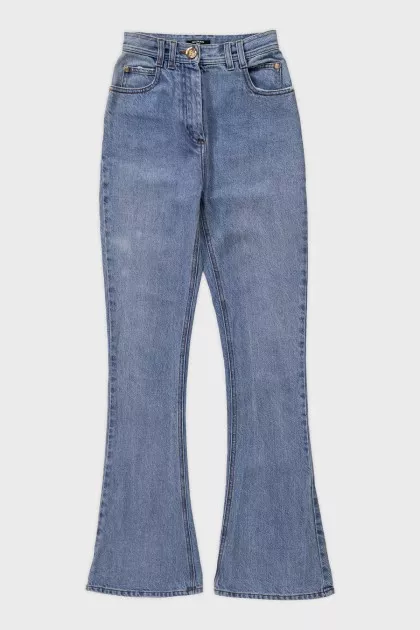 Light blue flared jeans with gold hardware