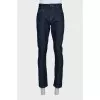 Men's dark blue straight leg jeans with a button
