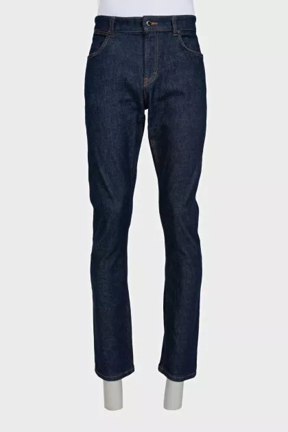 Men's dark blue straight leg jeans with a button