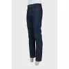 Men's dark blue straight leg jeans with a button
