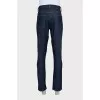 Men's dark blue straight leg jeans with a button