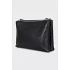 Black leather bag with a belt