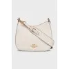 White leather bag with gold logo