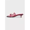 Red leather mules with heels and tag