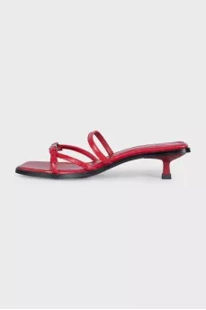 Red leather mules with heels and tag