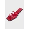 Red leather mules with heels and tag