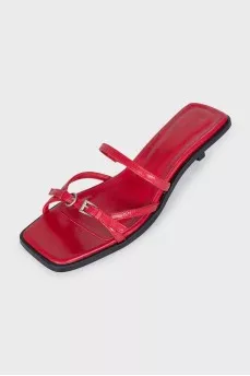 Red leather mules with heels and tag