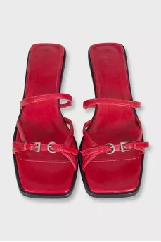 Red leather mules with heels and tag
