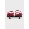 Red leather mules with heels and tag