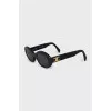 Oval sunglasses with gold logo