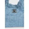 Denim bag decorated with fringe