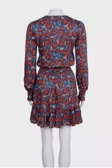 Blue fitted dress with a printed pattern