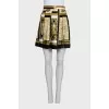 A suit with a skirt and top in a signature print