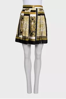 A suit with a skirt and top in a signature print