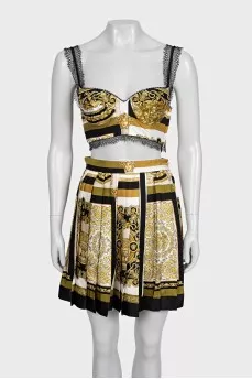 A suit with a skirt and top in a signature print