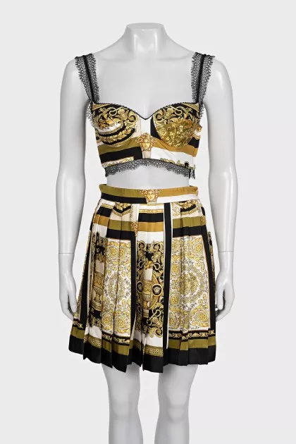 A suit with a skirt and top in a signature print