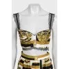A suit with a skirt and top in a signature print