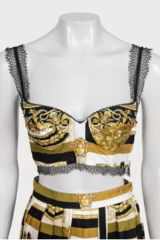 A suit with a skirt and top in a signature print