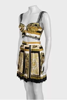 A suit with a skirt and top in a signature print