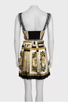 A suit with a skirt and top in a signature print