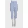 Blue cropped trousers with a striped print