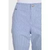 Blue cropped trousers with a striped print