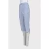 Blue cropped trousers with a striped print
