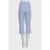 Blue cropped trousers with a striped print