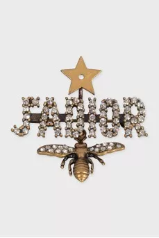 A set of earrings and a brooch