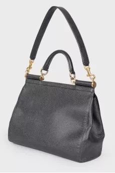 Black leather bag with golden fittings