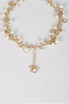 Golden bracelet with pearls