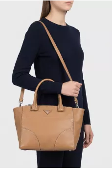 Brown leather tote with silver logo