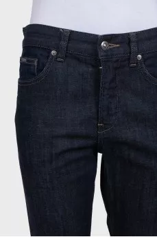 Dark blue straight-leg jeans with a button