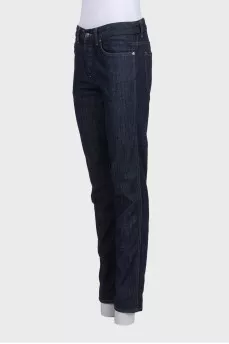 Dark blue straight-leg jeans with a button