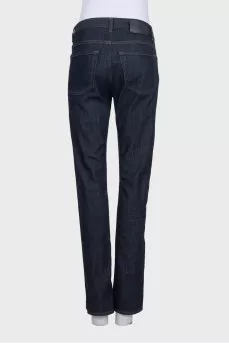 Dark blue straight-leg jeans with a button