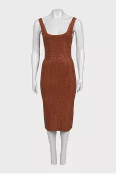 A brown bodycon dress decorated with rhinestones