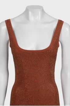 A brown bodycon dress decorated with rhinestones