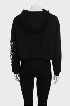 Black cropped hoodie with contrasting print on the sleeve