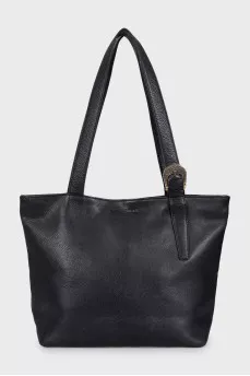 Black leather tote bag with gold buckle