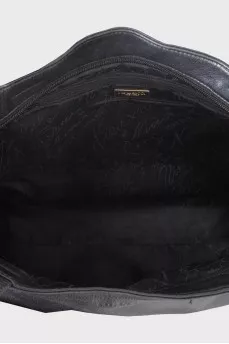 Black leather tote bag with gold buckle