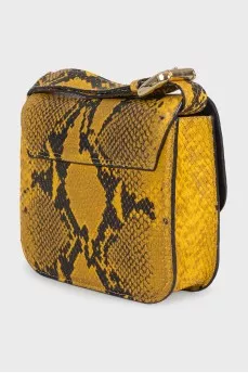 Yellow leather bag with embossed print