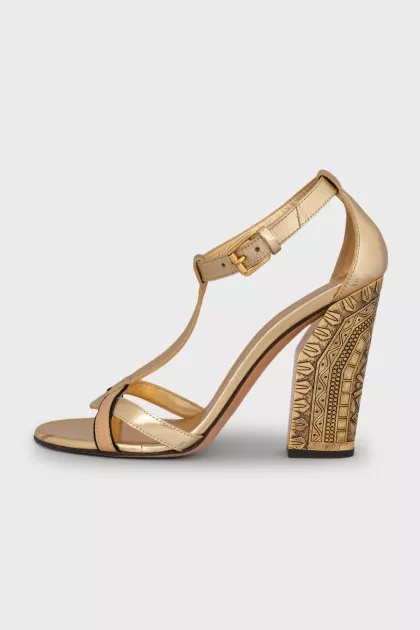 Gold heeled sandals with a 3D pattern