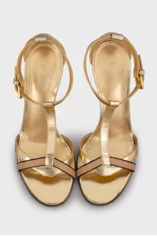 Gold heeled sandals with a 3D pattern