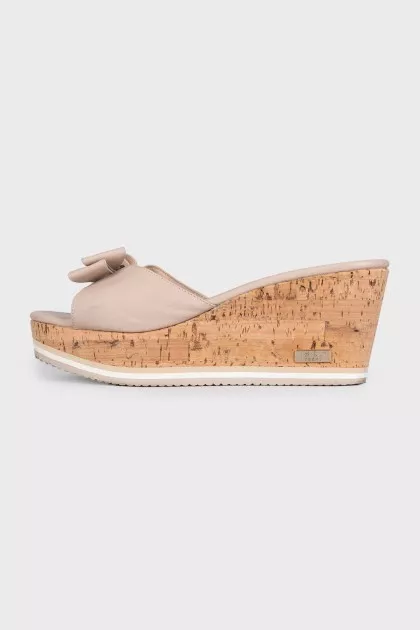 Beige leather mules with a wooden platform