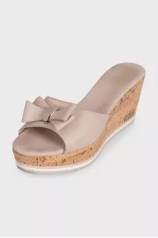 Beige leather mules with a wooden platform