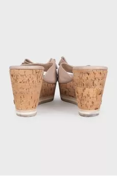 Beige leather mules with a wooden platform